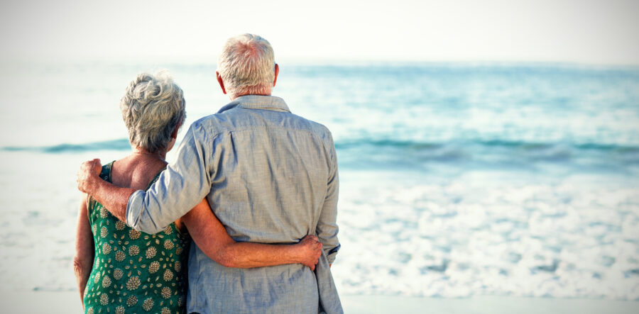 Senior man and woman on beach