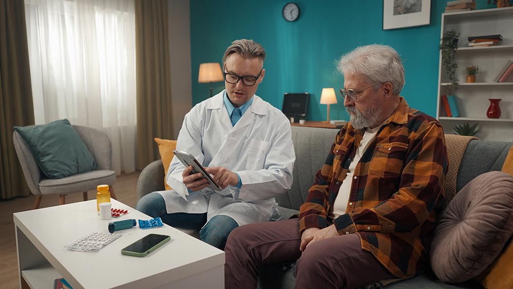 Doctor showing an elderly patient results on a tablet
