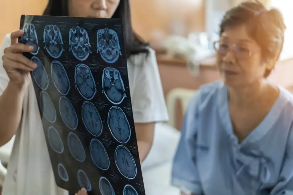 A doctor showing an elderly woman the results of a neuro scan
